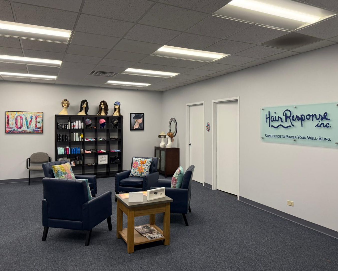 The reception and waiting area at the Hair Response office in Arlington Heights, Illinois, with wigs and hair pieces on display