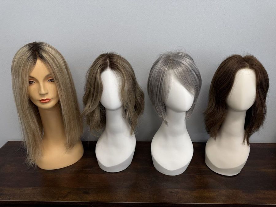 Custom wigs styled on display forms at Hair Response